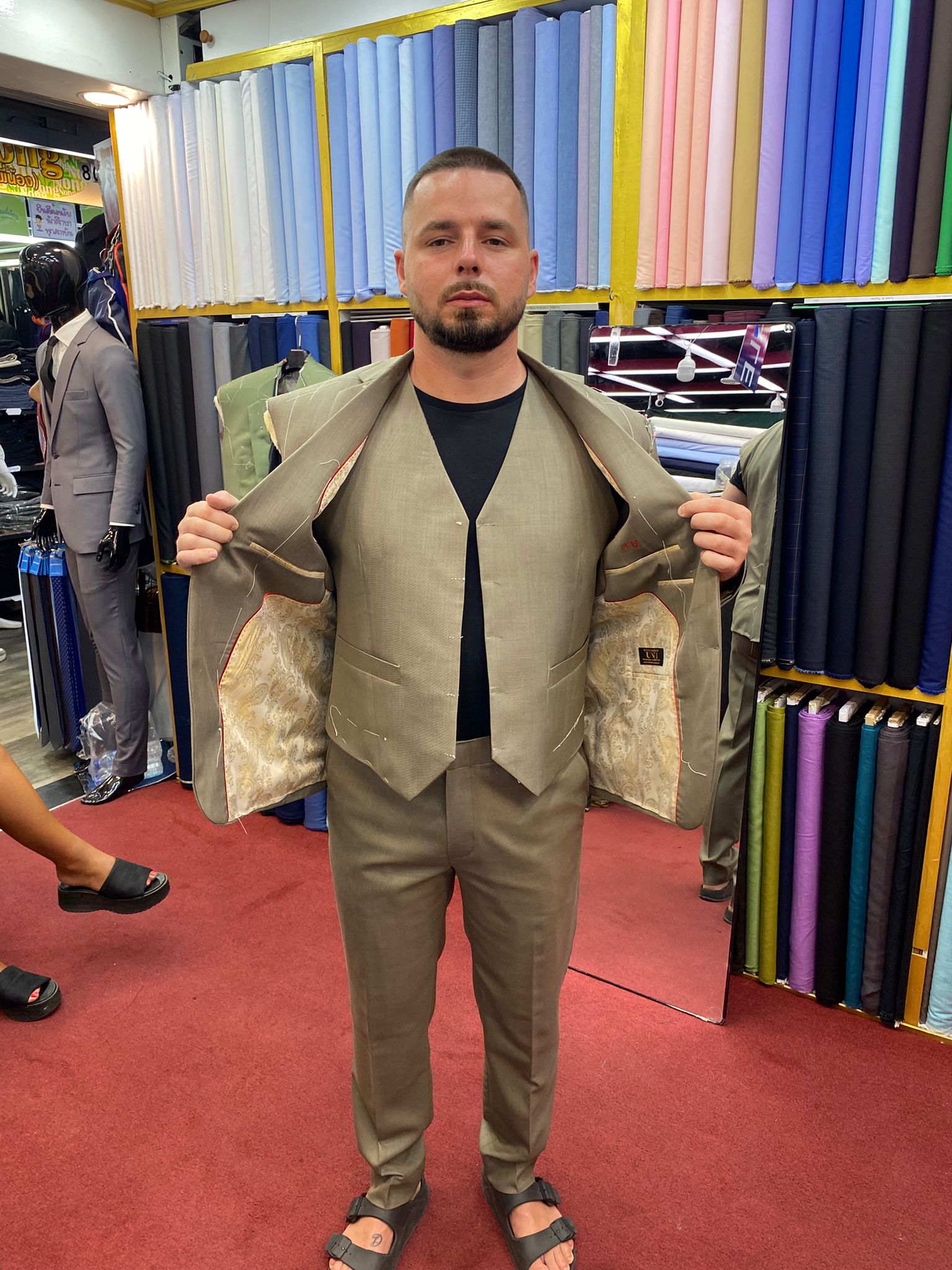 Happy client in custom tailored suit at King Fashion Uni Bangkok